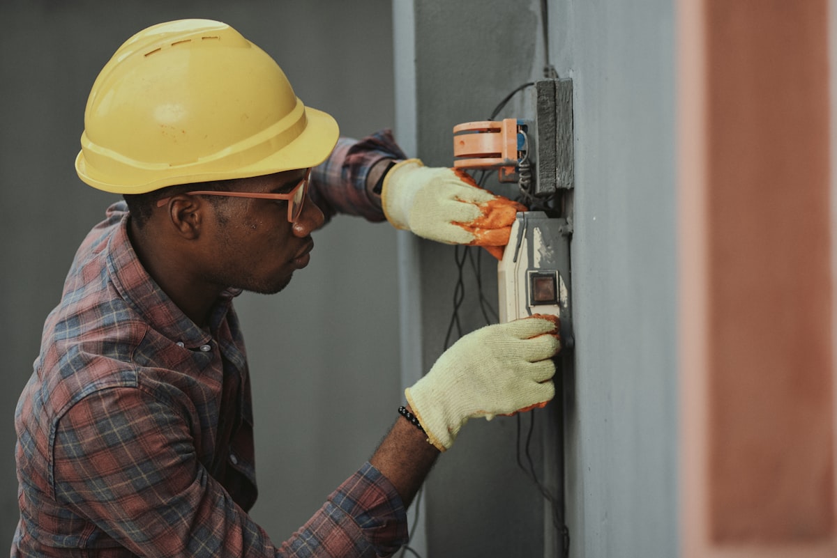 EH CONNECT technician installing fiber equipment at a customer's home
